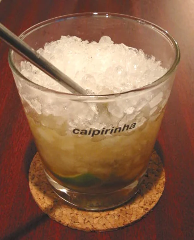 Caipirinha cocktail in a low glass with lime and cane sugar