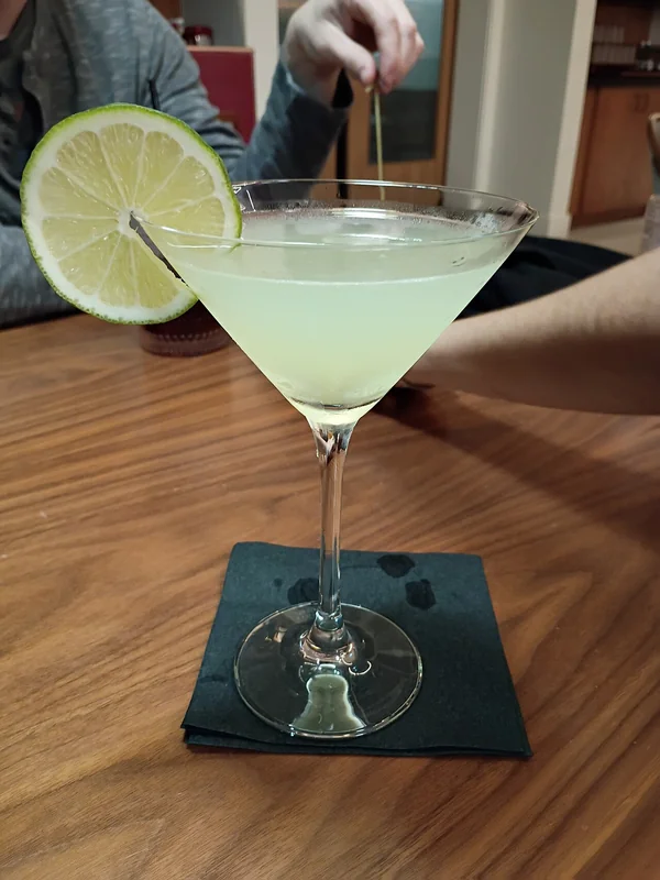 A Last Word cocktail — equal parts gin, green Chartreuse, maraschino, and lime