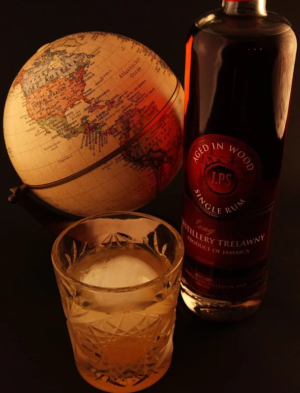 A Mai Tai tiki cocktail with tropical fruit garnish