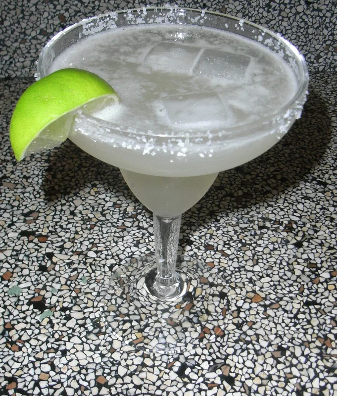 A Margarita cocktail in a salt-rimmed glass