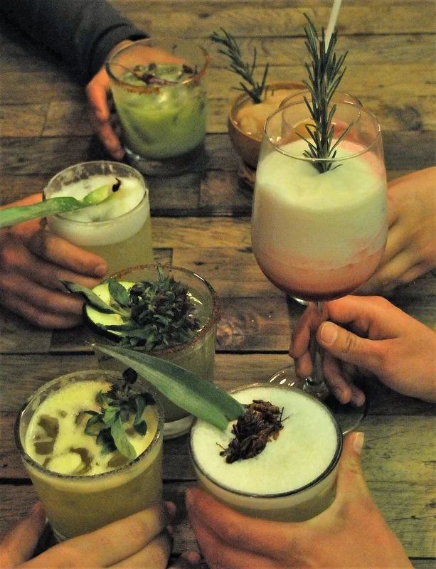 Mezcal poured in a traditional clay copita in Oaxaca, Mexico