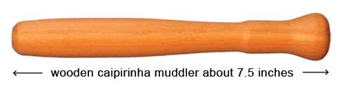 A wooden bar muddler used to press fruit and herbs when building a cocktail