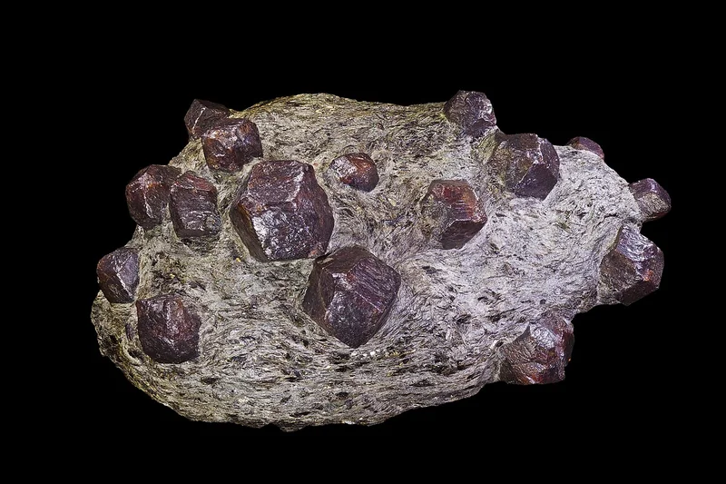 Almandine garnet specimen showing characteristic deep red colour and dodecahedral crystal form