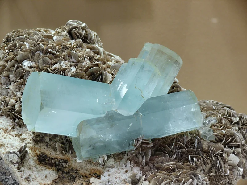 Aquamarine crystal cluster on albite matrix showing blue-green colour
