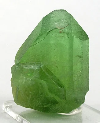 Peridot (gem olivine) crystals showing characteristic lime green colour representing August's birthstone