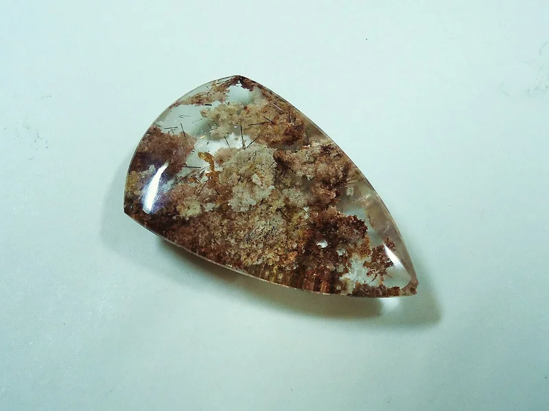 Polished cabochon-cut precious opal showing smooth dome form typical of cabochon cutting