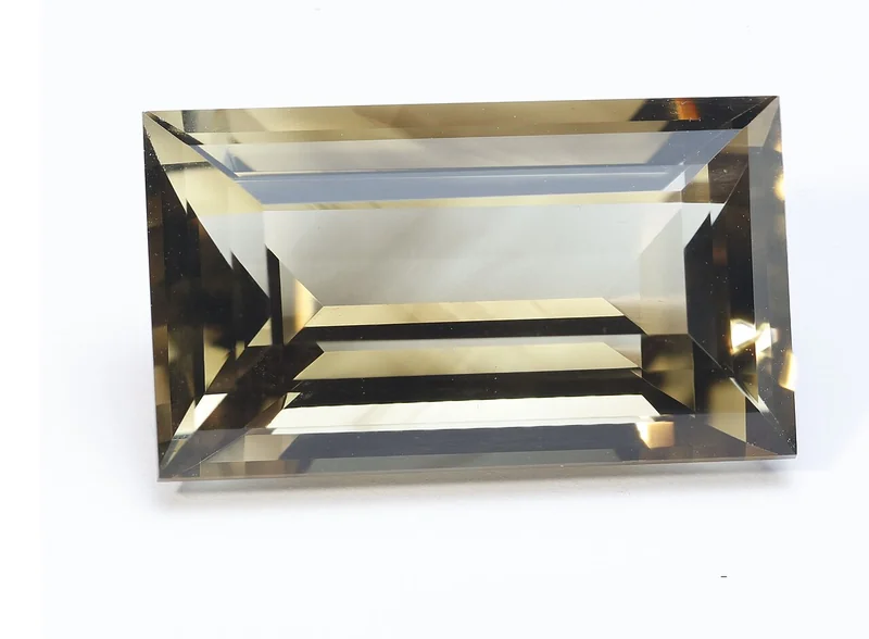Faceted citrine gemstone showing yellow-orange colour