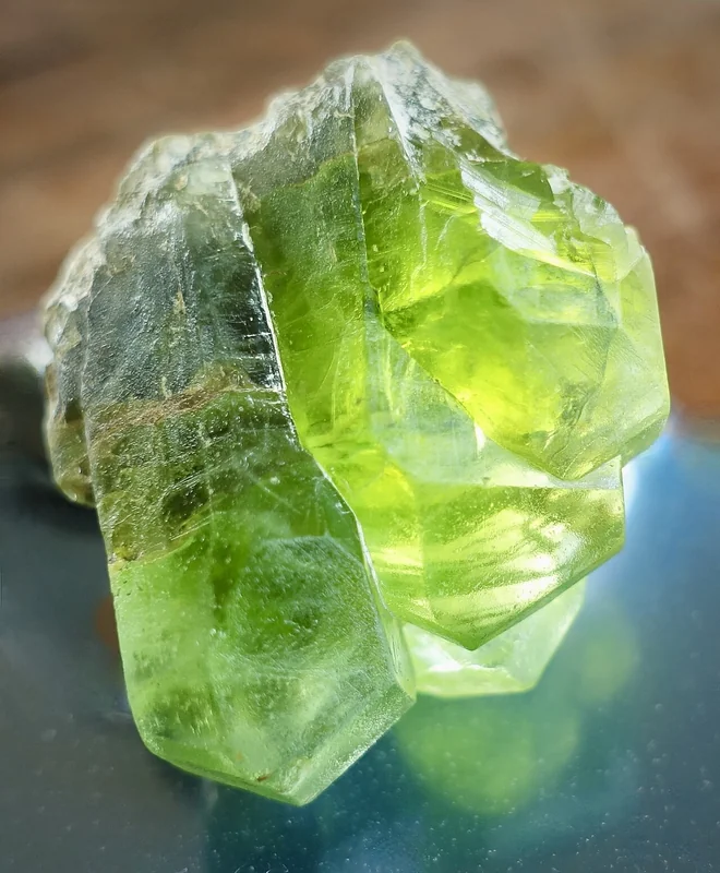 Faceted peridot gem showing characteristic yellow-green colour