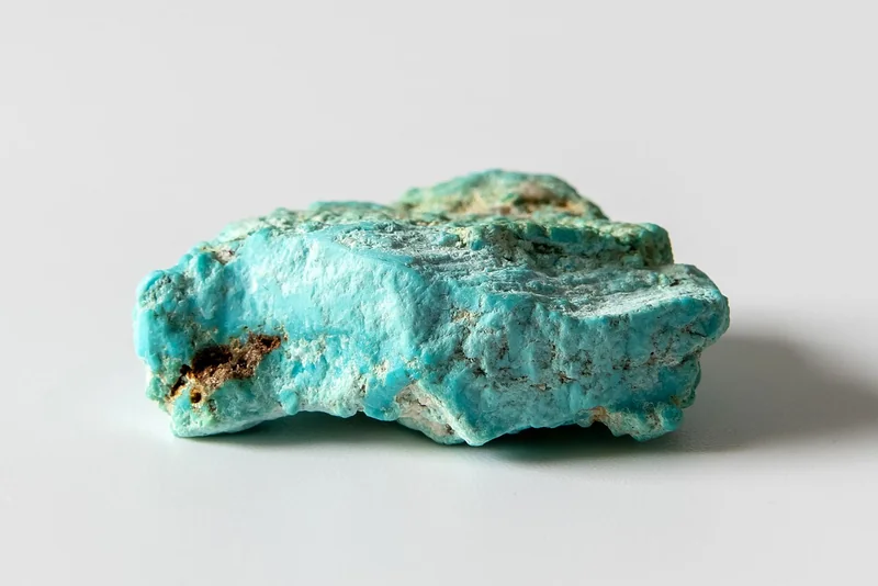 Polished turquoise specimen showing characteristic blue colour with matrix