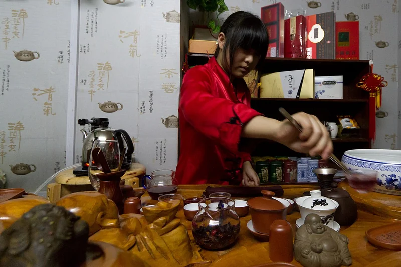 Gongfu cha tea session with small teapot and cups arranged on a tea tray
