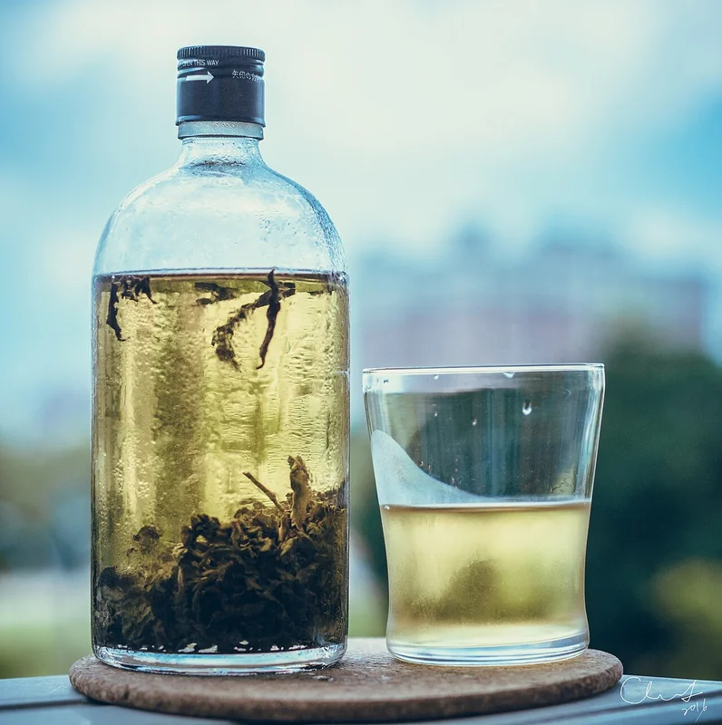 Cold-brew green tea steeping in a glass jar