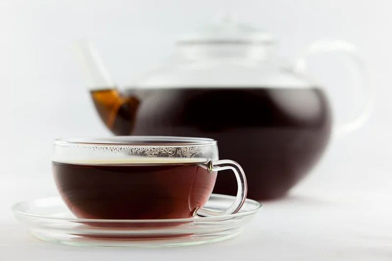 Dry Earl Grey tea leaves with cornflower petals