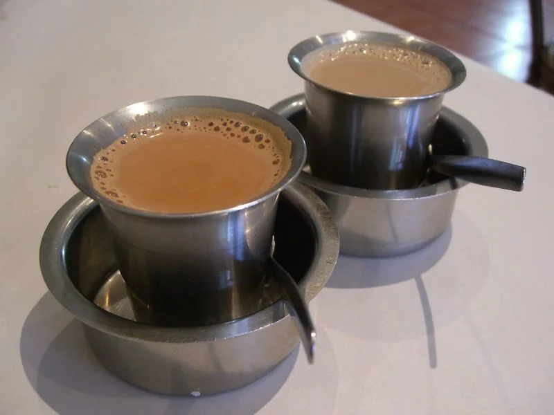 Indian masala chai served in traditional kulhad clay cups at a street stall