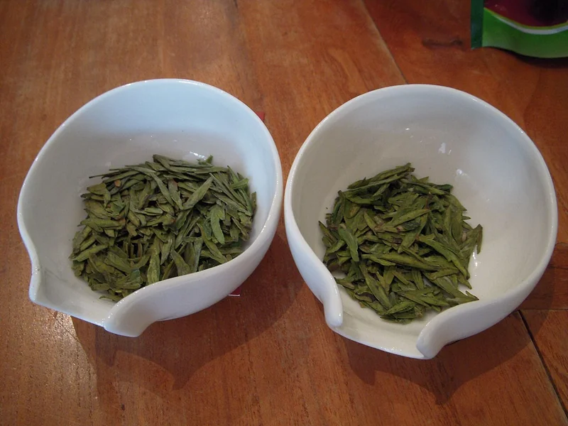 Flat, smooth Longjing (Dragon Well) green tea leaves