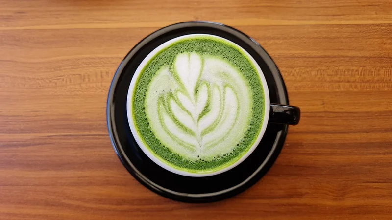 Bowl of matcha green tea with frothy surface