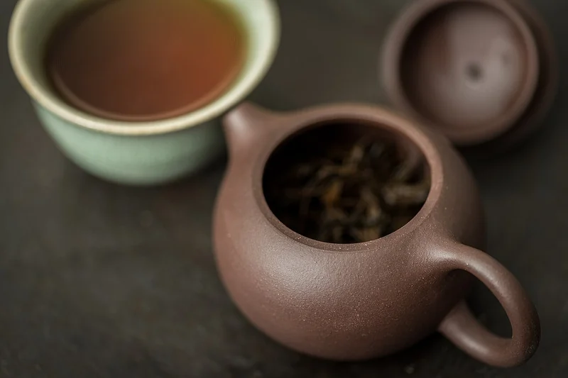 Yixing zisha clay teapots in purple and red clay