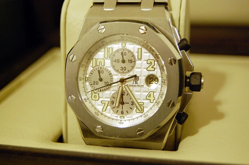 Audemars Piguet Royal Oak with blue tapisserie dial, octagonal bezel with eight screws, and integrated H-link bracelet