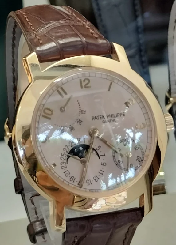Patek Philippe Calatrava round dress watch with white dial and hobnail bezel on leather strap