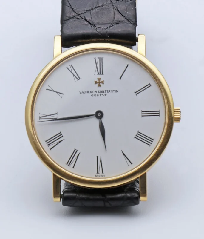 Vacheron Constantin Patrimony dress watch with minimalist dial, applied hour markers, and leaf-shaped hands