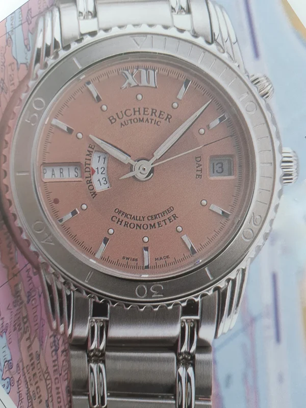 World time watch dial showing rotating city disc and 24-hour ring with all time zones displayed simultaneously