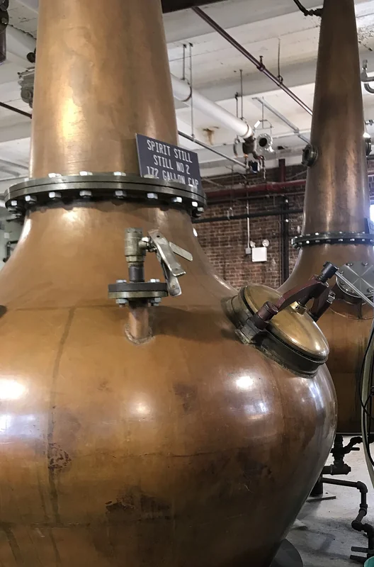 A copper pot still used in malt whisky distillation